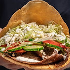 A delicious beef doner tops with fresh veggies made by Doner House