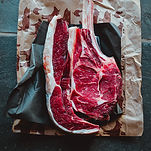 A tomahawk steak displayed on butcher paper at Kipfer's Heritage Farms