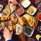A platter filled with delicious handcrafted empanadas from KW Empanadas