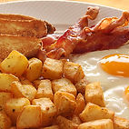 A plate full of breakfast foods 